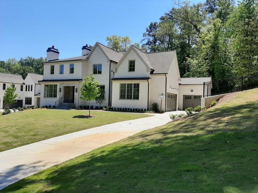 Hands down the best lot in the area!  Stunning home by Sunrise Custom Homes with 4 sides brick and a walk out, level back yard!  Hard to find in this area. Gorgeous hardwoods throughout with exquisite tile work and high end finishes make this home a contender in any price range, but the value offered in this home is unmatched.  Centrally located for everything fun in Atlanta or Sandy Springs and in the Sarah Smith School District, this home is luxurious, but livable! You will enjoy entertaining and raising a family here.