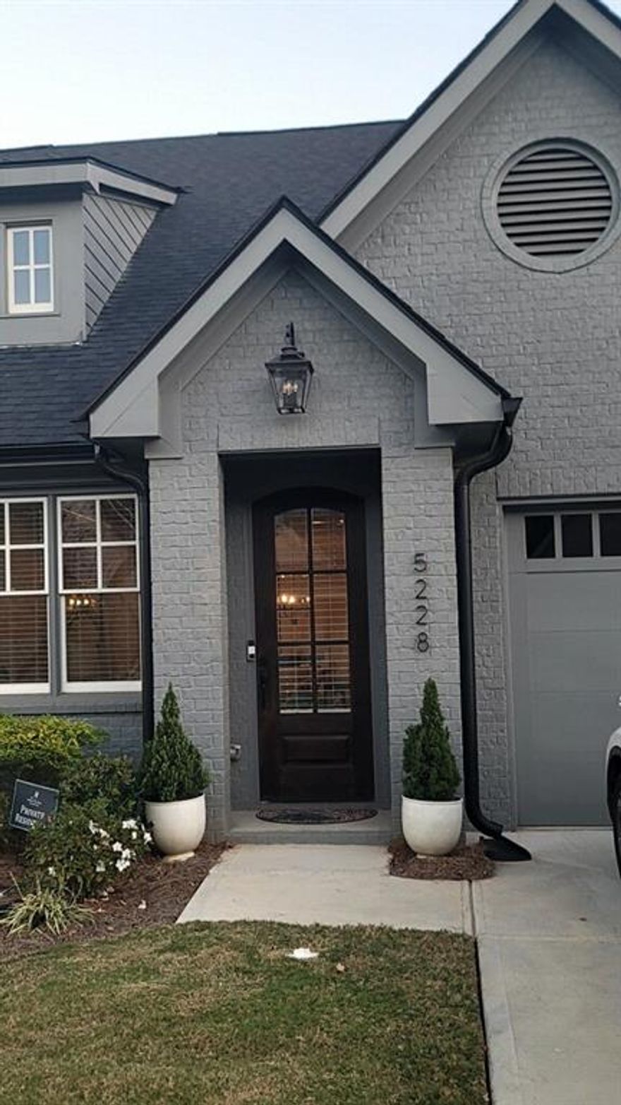 LOCATION, LOCATION, LOCATION! Cottages at Noble Village is a gated active adult community close to everything right in the heart of downtown Lilburn! 2 bedroom, 2 bath, 1 car garage ranch style home with a storage room. The kitchen boasts a large island, quartz countertops, SS appliances. LVP flooring throughout, wide hallways, and doorways for easy passage. Oversized owner's suite, double vanity, zero-entry shower, tile walls, tiled bench, ceramic tile flooring. The community clubhouse has a fitness center, parlor/lounge room complete with barn doors, full professional kitchen, and plenty of gathering areas, including an outdoor fire pit with seating. Short walk to restaurants, park, amphitheater, stores, and much more. It's truly an ideal lifestyle!