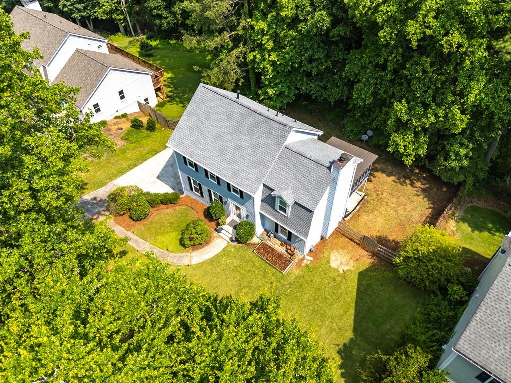Welcome to this beautifully renovated traditional home, ideally located in the highly sought-after WALTON High School District and just minutes from everything you need. This 4-bedroom, 2.5-bath gem is nestled in a vibrant swim/tennis community and perfectly blends classic charm with modern upgrades.
The main level features rich hickory hardwood floors throughout, complemented by upgraded windows and doors that fill the home with natural light. The fully renovated kitchen boasts custom cabinetry and elegant quartz countertops—perfect for everyday living and entertaining. Retreat to the spa-like primary bathroom, complete with a newer oversized shower with pebble flooring, upgraded countertops, fixtures, and hardware. Both the half bath on the main level and the guest bath upstairs have been tastefully updated as well. Downstairs, a finished playroom offers a flexible space ideal for a game room, media area, or kids’ hideaway. Step outside to enjoy a spacious screened porch overlooking a large, level, and fully fenced backyard—your private sanctuary for relaxation, family fun, or entertaining guests. Additional highlights include fresh interior paint and updates to the deck and sunroom. This home is move-in ready and ideal for families looking for quality living in East Cobb. Don’t miss your chance—schedule a showing today!