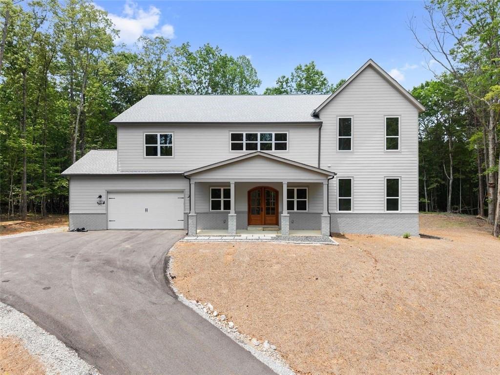 Welcome to your dream home — the best-built house in Georgia at the most competitive price per square foot in the state! This exceptional 5-bedroom, 4.5-bathroom estate is crafted with unparalleled attention to detail and offers a lifestyle of luxury, comfort, and efficiency.
Set on a sprawling 2.8-acre lot, this home combines the perfect blend of privacy and convenience, located just minutes from historic downtown Dahlonega and the vibrant shopping and dining scene in Dawsonville.
With a total of 6,480 square feet, this home features 18 rooms, including two expansive primary bedrooms with soaring 12-foot ceilings. Each guest suite is spacious, featuring 9-foot ceilings, walk-in closets, and private baths.
The heart of the home includes a gourmet kitchen with high-end Thor appliances, including a 48” gas, 6-burner double oven range with a pot filler, a walk-in pantry with custom cabinetry and granite countertops, and two laundry rooms — each with sinks for ultimate convenience.
The great room welcomes you through a solid mahogany entry door and boasts soaring 24-foot ceilings and a rare wraparound balcony. A custom-designed theater room with soundproofing insulation ensures a cinematic experience like no other, while the elegant formal dining room, adorned with intricate ceiling moldings, sets the stage for unforgettable gatherings.
Additional highlights include:
Three gas fireplaces
A private office
A full-sized mudroom
An oversized garage with a dedicated work area
For those with grand visions, the unfinished 1,840-square-foot basement with HVAC and built-in plumbing offers endless possibilities — ready to be transformed into a private apartment, in-law suite, or entertainment space.
Step outside to your expansive TREX deck, ideal for hosting large gatherings or simply enjoying the serenity of your surroundings. Equipped with a propane line for your grill and heat lamps, this outdoor retreat extends your living space in style.
This home has been constructed to exceed every expectation, with insulation, HVAC systems, and Energy Star-rated features that make it as energy-efficient as it is beautiful. From the tankless Rinnai hot water system to the superior construction methods that surpass local codes, this is a home built to stand the test of time.
This isn’t just a house; it’s a forever home. Come experience the luxury, quality, and elegance that make this property a true hidden gem!