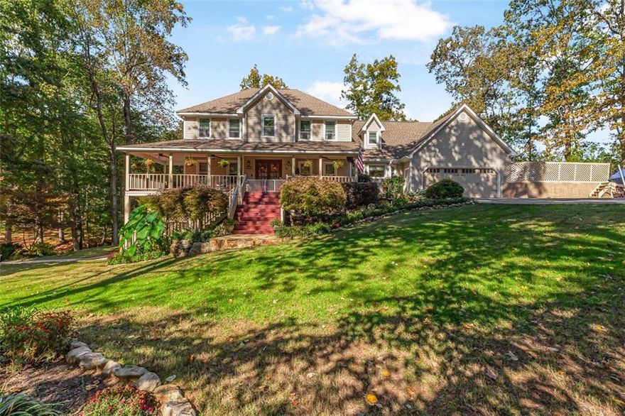 Welcome to your private lakeside retreat — a rare opportunity to own two adjoining lots totaling over 2.8 acres of beautifully landscaped property, including 31 Fawn Lake Trail NE and the adjoining 29 Fawn Lake Trail NE (1.2 acres). This expansive estate offers the perfect blend of nature, privacy, and modern comfort — with nearly 4,900 square feet of finished living space, including a top-quality finished basement apartment ideal for guests, in-laws, or additional income potential.

Enjoy the charm of the wraparound front porch overlooking lush gardens and mature trees, or take in peaceful water views from your private back deck and hot tub. The property’s open grounds provide endless possibilities — plenty of space to add a pool, soccer field, or outdoor entertaining area.

Inside, the home is designed for comfort and versatility, featuring 5 spacious bedrooms, 3.5 baths, and multiple bonus areas, including an upstairs flex room perfect for an office, craft space, or storage. The renovated kitchen boasts granite counters, double ovens, a gas range, stainless-steel appliances, and a new dishwasher. The main-level bath has been fully remodeled with a walk-in shower, and the home includes numerous recent upgrades:

New HVAC systems for the basement and main level

Tankless hot water heater

Six new upstairs windows

Newly painted decks

New outdoor hot tub with deck extension

A detached second garage/workshop offers abundant storage and parking for vehicles, boats, or hobbies. From the tranquil lakefront dock to the beautifully manicured gardens, every inch of this property has been lovingly maintained for the ultimate indoor-outdoor lifestyle.

Perfectly located in a quiet, wooded community — yet minutes from schools, shopping, and local conveniences — this home combines privacy, space, and scenic beauty in one of the area’s most desirable settings.