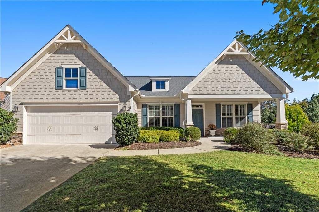 Welcome to your dream home at 319 Laurel Lookout Hills in Canton, GA! This stunning ranch-style residence, nestled on a serene wooded lot in a peaceful cul-de-sac, offers over 2,500 square feet on the main floor. Enjoy magnificent views from the large master suite, a true retreat with an expansive in-suite bathroom. The home features beautiful wooden floors and a gourmet kitchen, complete with two elegant butler pantries. The cozy living room, with a fireplace and built-ins, is perfect for relaxation and gatherings.
Explore the partially finished daylight basement, boasting an additional 1,100 square feet with two recreation areas, a fourth bedroom, and a full bath. This space is perfect for entertaining guests or enjoying family activities.
Located in a gated community, residents have access to amazing amenities, including a pool, gym, tennis court, and even a golf course. With directors for activities, fitness, and racquetball, there's always something exciting to do. Experience the tranquility and seasonal views of this exceptional home. Come see it for yourself and fall in love!