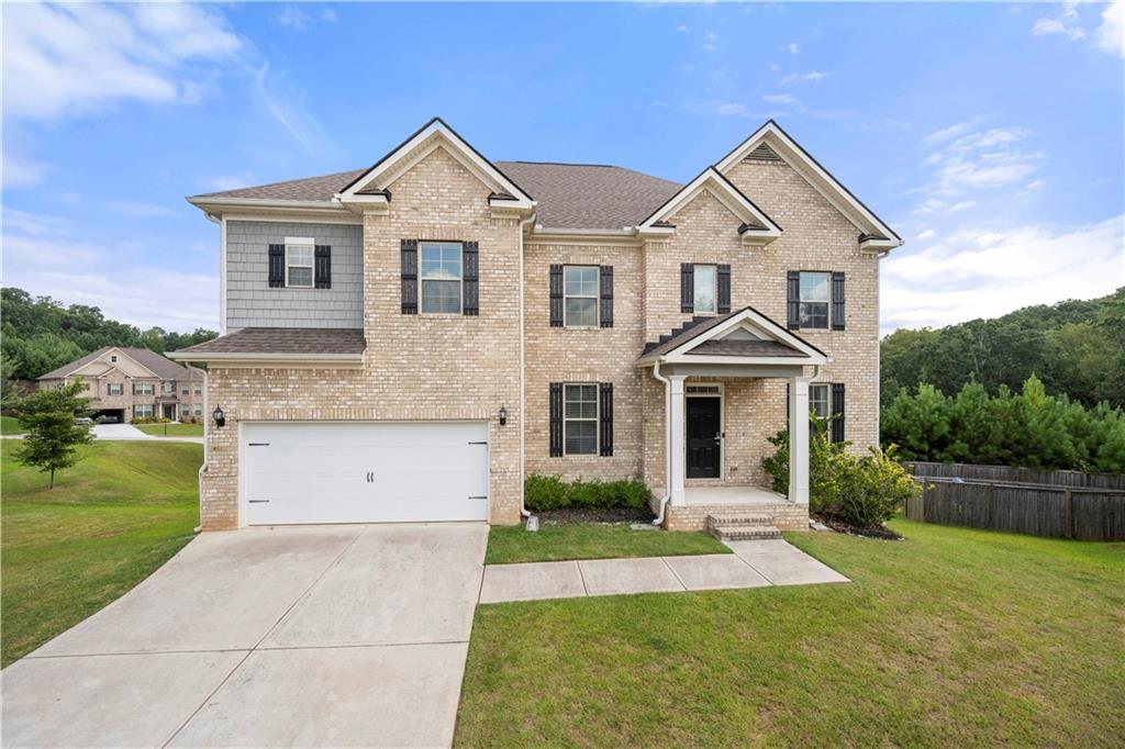 ***FHA Assumable Loan Available*** Don't miss this opportunity to take advantage of a 3.25% interest rate! Welcome to this exquisite home on a cul-de-sac lot located in a beautiful community with resort-style amenities. This isn't just a home; it's a lifestyle upgrade! As you enter the foyer leading to a spacious, open concept layout, enjoy the charm of this well-maintained home. Entertain in the expansive formal dining and living rooms or enjoy the gourmet chef's kitchen, featuring an oversized breakfast bar, eat-in breakfast area, granite countertops, white cabinets, and stainless steel appliances. The oversized family room includes a cozy fireplace and a wall of windows with plenty of natural light. The main level also features a guest bedroom while the master suite offers a private sitting room with a cozy fireplace, walk-in closet, and a luxurious en-suite bath with a soaking tub and separate shower. The full unfinished daylight basement is already studded for a bathroom - ready for your personalized design touches. Host your family and friends on the kitchen deck or enlarged back patio with a like new hot tub that will be staying at no additional charge and offers endless possibilities for relaxation and entertainment. Enjoy the seamless blend of luxury and convenience, with premier shopping, dining, and effortless highway access just moments away. Perfectly situated in the Camp Creek market area, only minutes from Hartsfield-Jackson International Airport and just 17 miles from the vibrant heart of Downtown Atlanta, this is more than a home - it's an experience of unparalleled elegance and luxury. Call today for loan details and to schedule your showing! You won't regret it!