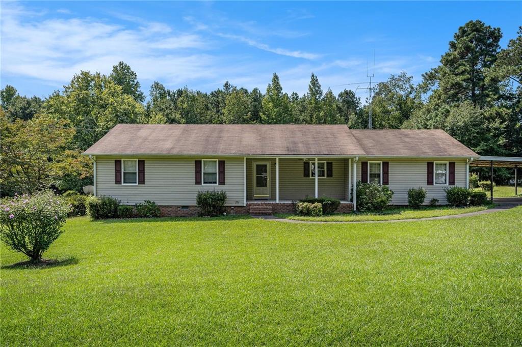 Charming 3-bedroom, 2-bath ranch situated on almost an acre, offering the perfect blend of space and potential. A welcoming front porch sets the tone as you step inside to a large living room and an inviting eat-in kitchen area, ideal for gatherings and everyday living. Located just minutes from I-20, local shopping, dining, and the historic Covington Square, this home combines small-town charm with convenient access to big-city amenities. A perfect opportunity to make this home your own with your personal touches!