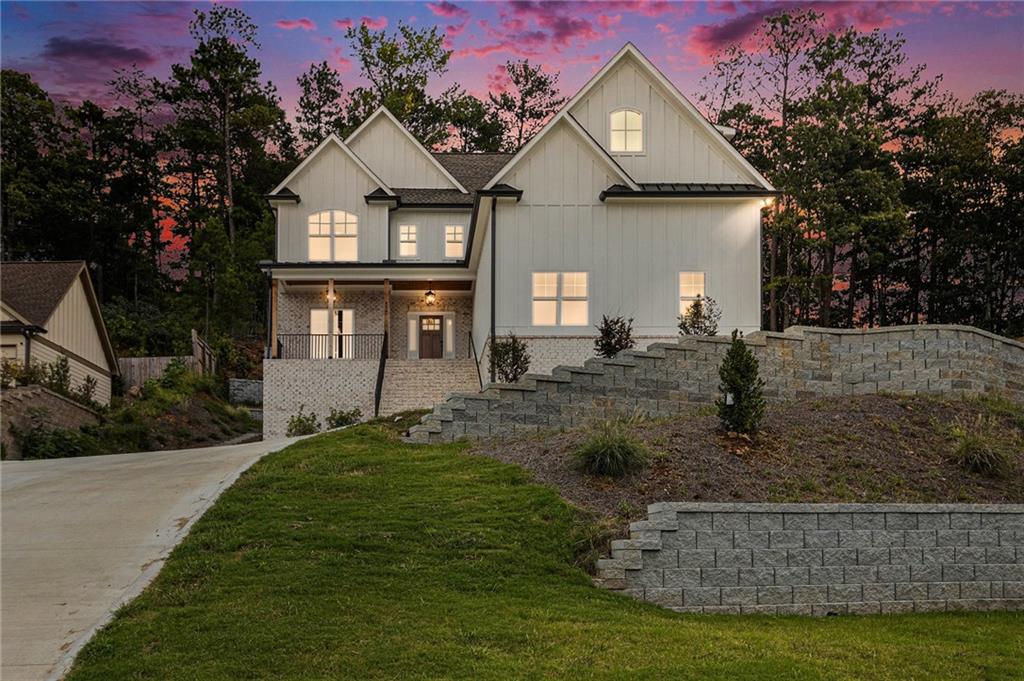 Your Dream Modern Farmhouse Awaits – Lake Views, Luxe Living & Endless Possibilities!
Welcome to a home that truly has it all—breathtaking lake views, two luxurious primary suites, and space to create your forever retreat—all in the coveted Spring Lake Shores community of White, GA. Step inside and be wowed by the bright, open layout designed for today’s lifestyle. The stunning chef’s kitchen—with its oversized island—flows effortlessly into the spacious living and dining areas, perfect for entertaining or cozy nights in. Downstairs, the massive 12-foot ceiling basement is already prepped for your dream build-out—imagine a home theater, second kitchen, or ultimate guest suite! This new built home is nearly complete and awaiting your final touches: choose your preferred walk-in closet layout, bathroom mirrors, refrigerator, and microwave. Nestled on a peaceful cul-de-sac, surrounded by woods and overlooking the lake, this home feels like a luxury getaway—but it’s just minutes from I-75, shopping, dining, and all that North Georgia offers.
This isn’t just another new home—it’s a lifestyle, a statement, and the perfect place to start your next chapter.