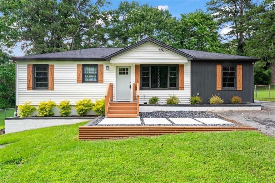 Stunning 3-bed, 2-bath craftsman-style ranch nestled in historic Mableton! Perfectly positioned between Atlanta and Powder Springs, this stylish retreat features accent walls, designer-tiled bathrooms, and a spacious screened-in porch ideal for relaxing or entertaining. Enjoy one-level living with a large, level backyard—great for gatherings, gardening, or play. Convenient to parks, schools, and major highways, this home offers the perfect mix of comfort, character, and convenience for a vibrant lifestyle.
