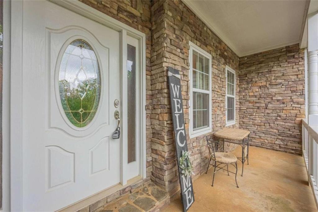 Welcome Home to this Fabulous City of Jefferson Home! From the covered front porch, step into the Foyer entry open to the Formal Dining Room. Easy flow continues into the Living Room with fireplace, open to the Breakfast Room and Kitchen. Primary Bedroom on Main Level with double vanity, whirlpool bath, tile shower, and large closet. Additional Bedrooms and Full Bath upstairs with Flex Space, perfect for Office, Media Room, or Play Room. Basement Level is unfinished with tons of storage space and workshop setup, with separate garage entry connecting to a 2nd driveway. You won't want to leave your back yard all summer long! Lovely deck/patio space, saltwater pool, with mature trees surrounding the yard, providing a wonderful place to entertain or a peaceful retreat at the end of your day. Current Owners have recently updated flooring, and a new driveway will be poured prior to closing. All of this in a great neighborhood, in a rural area, but still in the City Limits! Just 10 minutes to Downtown Jefferson, City Schools, and tons of local shopping and dining, 15 minutes to I-85 access, 25 minutes to Athens.