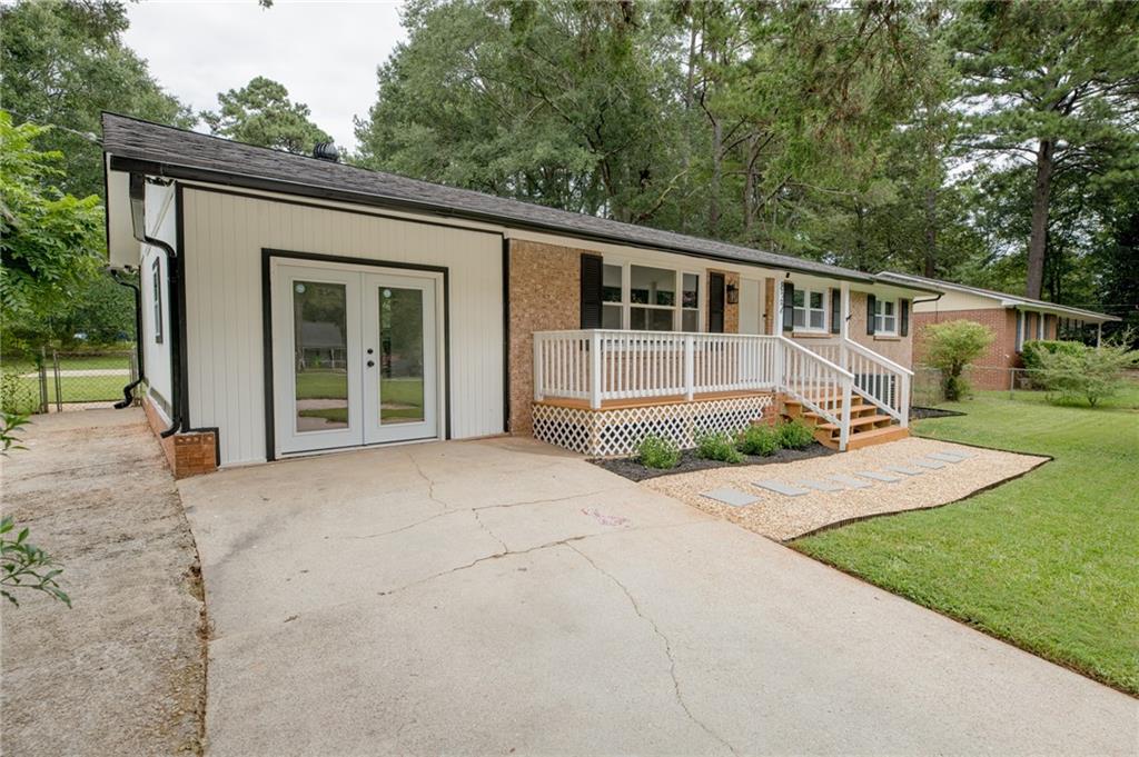 This newly renovated 3-bedroom, 2-bathroom home has been thoughtfully modernized from top to bottom, blending style, comfort, and functionality.
Step inside to discover new flooring, windows and doors, and a re-imagined kitchen complete with granite countertops, a farmhouse sink, and brand-new stainless-steel appliances. A separate laundry room, featuring a brand-new washer and dryer, adds both convenience and efficiency.
The updated primary bathroom boasts a new walk-in shower and dual vanity to create a retreat-like atmosphere. An additional full bathroom has also been beautifully updated to serve family and guests alike.
A spacious and versatile bonus room offers endless possibilities—whether you envision a private home office, guest suite, or creative studio, this flexible space adapts to your needs.
Outside, enjoy the expansive half-acre corner lot, perfect for recreation and relaxation. The screened-in back deck invites you to unwind while watching the sunset, while the newly installed basketball goal adds a touch of fun for all ages.
Located in a peaceful neighborhood just minutes from I-20, shopping, and dining, this home offers the best of both worlds: a tranquil retreat with quick access to everyday conveniences.
Don’t miss your chance to own this beautifully updated property—schedule your showing today!