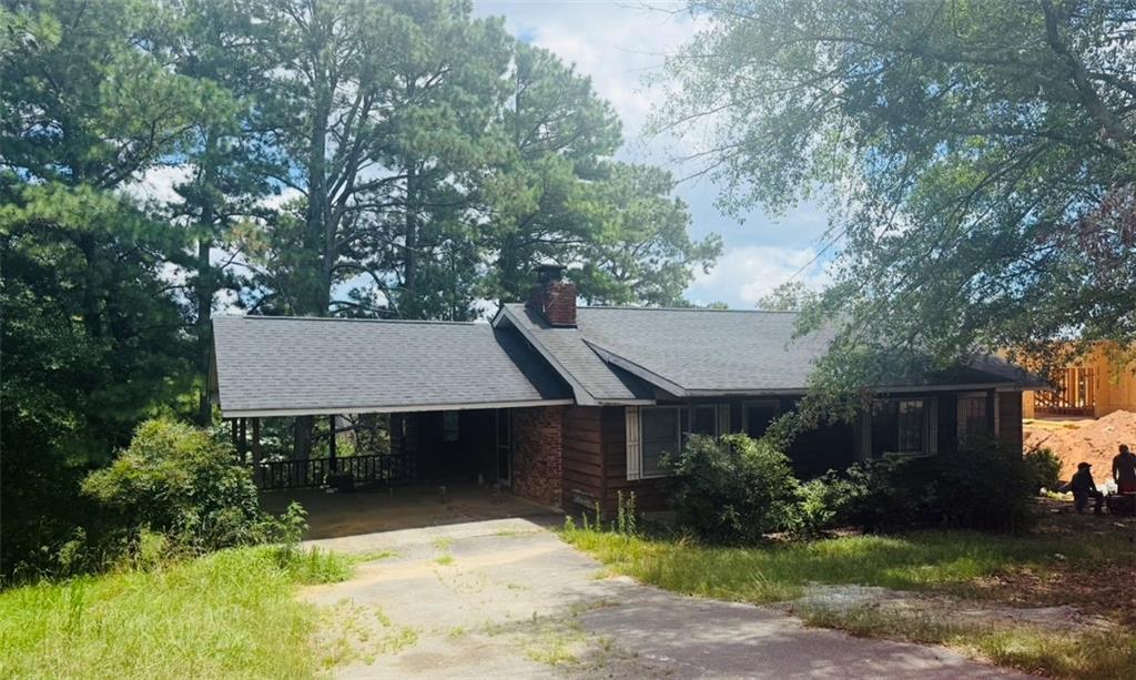 Rare Opportunity in Buford City Schools ? No HOA & Ideal for Redevelopment! Welcome to 3273 N Bogan Rd, a charming 3-bedroom, 2-bathroom single-family home nestled on a beautifully secluded 0.724-acre lot in the highly sought-after Buford City School District. Built in 1975 and offering 1,306 square feet of living space, this home presents endless potential. Whether you're looking to renovate, expand, or redevelop the property altogether. Surrounded by mature trees and tucked away from the road, the lot offers the perfect blend of privacy and convenience. Located just minutes from the Mall of Georgia, Lake Lanier, parks, dining, and with easy access to major interstates, this location is unbeatable. With no HOA restrictions, the possibilities are wide open. whether you're a homeowner, builder, or investor looking for your next project in one of Gwinnett County's most desirable areas. Don't miss this incredible opportunity to own a spacious lot with development potential in the heart of Buford!