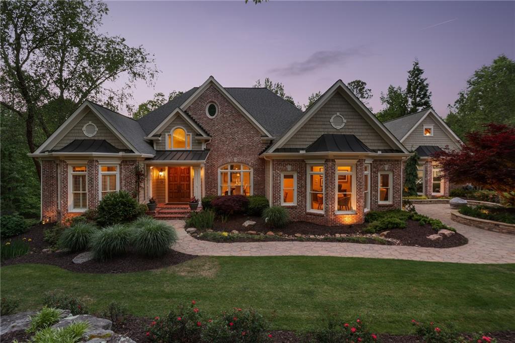 Welcome to your private paradise! If you value the privacy of being on multiple acres but also would like to enjoy the benefits of being in a neighborhood, this property is for you. This glamorous and well-appointed ranch-style home is nestled on a breathtaking 8-acre lot, complete with a picturesque, tree-lined driveway, professional landscaping and a large backyard. More than half of the acreage is densely wooded, requiring no upkeep and providing an abundance of exploration. You'll enjoy the pool and the treehouse and there is plenty of space to add a large playset and even zip lines. As you step through the front door
and into the foyer, you are immediately greeted by an elegant dining room adjacent to a custom bar area, equipped with a dishwasher, refrigerator, and ice machine making it the perfect setting for entertaining and impressing your guests. Each corner of this home is adorned with designer and custom touches, showcasing a meticulous attention to detail-including designer lighting throughout, adding an ambiance of sophistication and warmth. The family room, a true masterpiece of the home, opens seamlessly into a cozy sitting room and a state-of-the-art kitchen. The kitchen is a chef's dream with a massive stone island and expansive windows that not only flood the space with natural light but also offer stunning views of the lush landscaping. Step out onto the oversized
deck for a breath of fresh air and a closer look at nature's artwork. The main level features a luxurious primary suite with a newly updated spa-like bathroom, including a deep soaker tub, an oversized, zero-entry shower, and a vast custom his-and-hers closet. Adjoining the suite is a sitting room-perfect for a home office-leading to a private, screened deck, offering a serene retreat, free from the elements yet still connected to the tranquil outdoors. Additionally, the main level includes a convenient mudroom/laundry room, a stylish half-bath, and a separate office that can double as an additional bedroom. Venture downstairs to
discover three more spacious bedrooms, each with their own en suite, a vast recreational room, and a dedicated media room, perfect for movie nights or hosting lively gatherings. Ample storage space ensures a clutter-free living environment. Outside, the fenced pool area beckons with its sparkling gunite pool, inviting bar and outdoor grill, and charming stone surrounds. Truly unmatched in its offerings, this estate promises a luxurious living experience surrounded by natural beauty and exquisite indoor spaces. It's more than a home-it's a lifestyle waiting to be embraced.