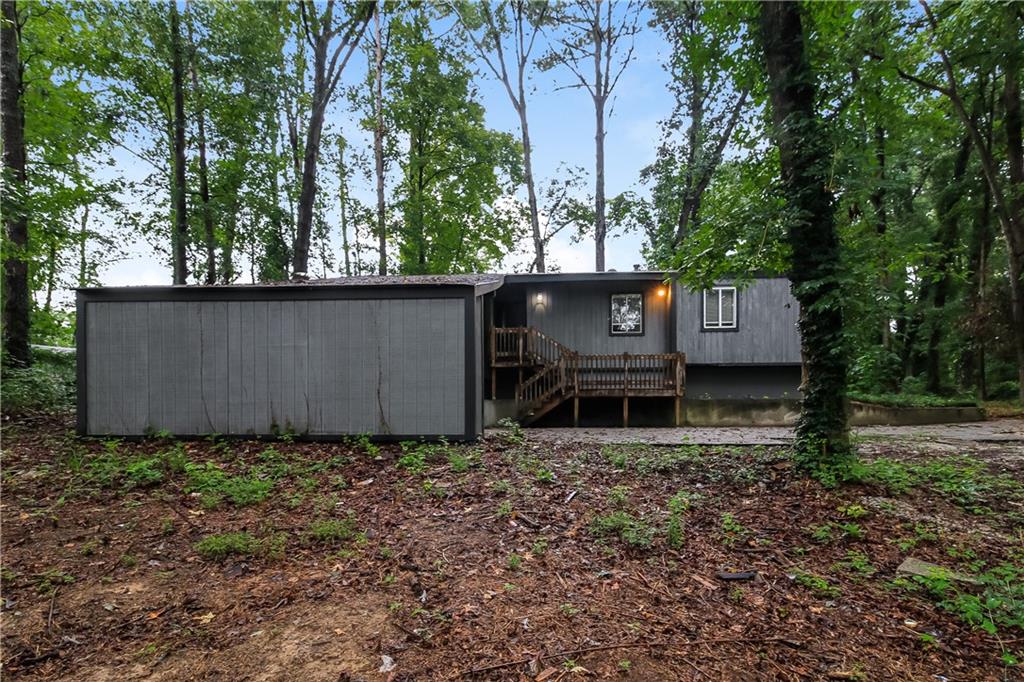 Welcome to this beautifully renovated 3-bedroom, 2-bath ranch in Conyers’ Winchester Hills! Step into the 70’s-inspired sunken living room that flows right into the kitchen and dining area—perfect for gatherings and entertaining. The kitchen features gorgeous solid-surface countertops, soft-close drawers and cabinets, stainless steel appliances, and a breakfast bar that ties it all together.
The owner’s suite is a dream with its sliding barn-door closet, double sinks, and a spa-like shower with body jets. Two additional bedrooms share a full bath highlighted by a stunning brass showerhead and matching fixtures. Out back, enjoy a semi-covered patio complete with a fire pit—ideal for relaxing evenings or hosting friends.
This home has been thoughtfully updated with love and care, and it truly shows. Don’t wait—this one won’t last!