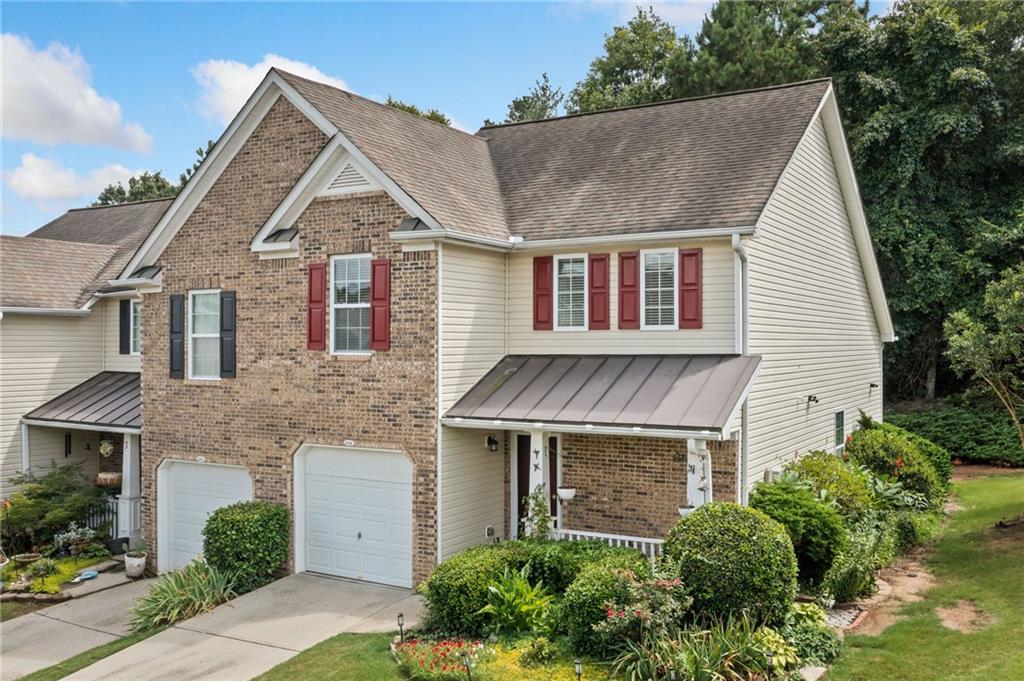 Great opportunity in Fox Creek, a townhome community located in popular Woodstock! This updated townhome includes a rare first floor primary bedroom and bath. Perfect for one level living with a second-floor guest suite or a roommate plan with each person having their own bedroom and full bathroom. Move-in and enjoy brand new luxury vinyl plank flooring on the main level and new carpet on the second floor. The home has been freshly painted throughout. Fully upgraded kitchen with white shaker cabinets, quartz counters, and stainless-steel appliances. The fist floor bathroom has been updated with a large walk-in shower, new vanity, and storage cabinet. The second floor features a large loft area for office or media use. The backyard has an oversized patio perfect for a small garden, grilling, or enjoying a cold beverage. Woods behind make the area very private. This is an end unit with a one car garage. The community amenities include a pool, tennis courts, and playground. Minutes to Woodstock downtown, Costco, the Outlet Mall, I575, and walking distance to shopping and restaurants!!