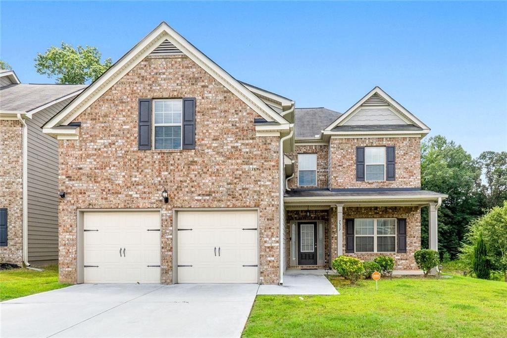 Welcome Home to Comfort, Style & Convenience! Step inside this beautifully maintained Thornton floor plan offering 5 spacious bedrooms and 3 full baths, perfectly designed for modern living. Priced to sell, last year, this house appraised for $387k. Built in 2020 with a classic brick front and a welcoming rocking-chair front porch that is perfect for your morning cup of coffee/tea or simply to relax in, this home has the curb appeal and comfort you’ve been looking for. The main level features luxury vinyl plank flooring throughout, combining elegance with easy maintenance. Real wood stairs lead to the second floor, adding warmth and character. Hosting in-laws or guests? The main-level bedroom offers privacy and convenience. You'll love the open-concept kitchen with recessed lighting, an abundance of cabinetry, a generous walk-in pantry, and seamless flow into the oversized family room with a cozy gas fireplace that's ideal for entertaining or relaxing. The separate formal dining room with coffered ceilings sets the stage for unforgettable dinners and celebrations, allowing more room for seating. A practical mudroom off the 2-car garage keeps things tidy and organized. Upstairs, retreat to your large owners suite with room to unwind in the sitting area. Need a playroom or a man cave? One of the oversized secondary bedrooms is the perfect flex space, big enough for a pool table, game room, or media lounge. Enjoy the outdoors year-round on the covered patio, which can easily be screened in for added comfort and privacy. All of this, and it’s just 19 minutes to Hartsfield-Jackson Airport and under 30 minutes to downtown Atlanta to catch a show or have dinner, a commuter's dream!
This home checks all the boxes for space, functionality, and location, all at an unbeatable price. Schedule your showing today, before it is gone tomorrow!