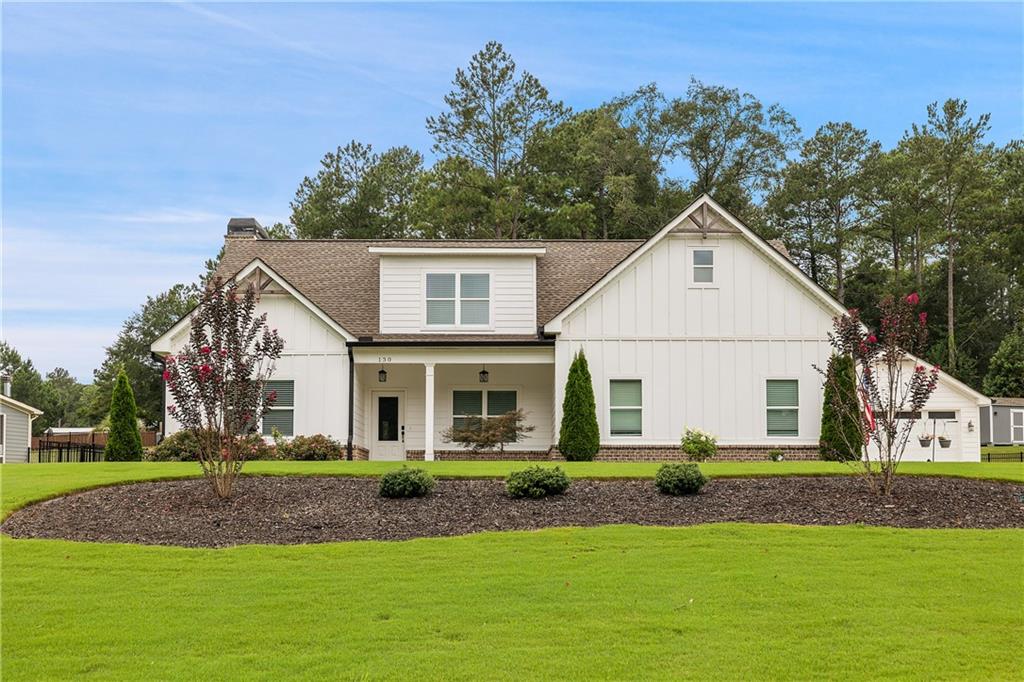 Experience timeless sophistication in this distinguished ranch-style residence, perfectly situated within a beautifully maintained, HOA-free community. Designed to balance privacy with a welcoming neighborhood setting, this home offers an array of exceptional features, including four-car garage parking (2 car attached, & 2 car detached with workshop area) and a fully fenced backyard for both comfort and security. From the moment you arrive, the property's striking curb appeal sets the tone for the refined elegance that awaits inside. The expansive open-concept floor plan flows seamlessly from one space to the next, creating a graceful setting ideal for both entertaining and everyday living. At the heart of the home lies the gourmet chef's kitchen, appointed with a generous island and overlooking the family room with soaring vaulted ceilings. Thoughtfully designed with premium cabinetry and finishes, this culinary space inspires both creativity and convenience. The primary suite on the main level offers a private retreat, complete with a spa-inspired bath. Indulge in the freestanding soaking tub or unwind in the spacious walk-in shower with built-in seating, an atmosphere reminiscent of a luxury getaway. Main level guest bedroom with full bath or use it as an office/den. Two Secondary bedroom suites upstairs for privacy! All appliances included, even two hot water tanks! Every detail of this home has been carefully considered to provide exceptional comfort without excess, creating a harmonious balance of style and functionality. Do not miss the opportunity to call this extraordinary property your own. Schedule your private tour today and discover refined living at its finest.