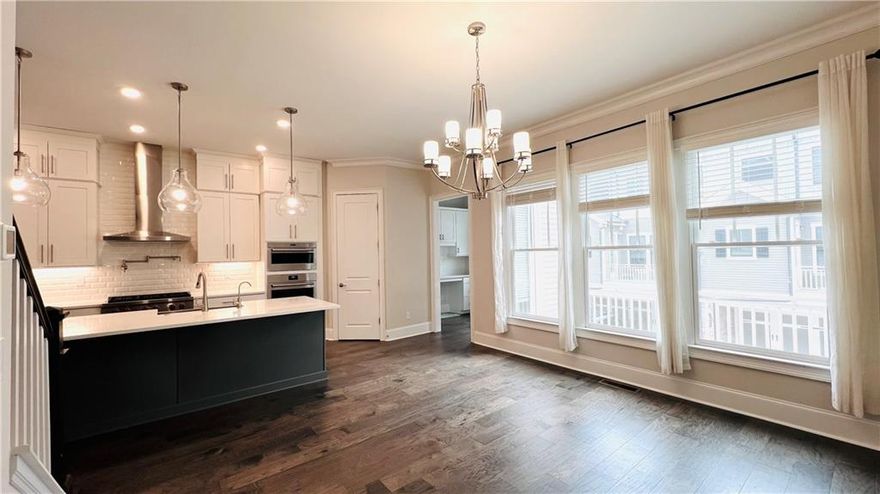 Walk to Milton Downtown. This exquisite three-story townhome offers a luxurious and comfortable living experience, conveniently located within walking distance of Milton’s charming downtown area.
The lower level features a spacious, versatile room ideal for use as a bedroom, home office, or media room, complete with a full bath. The garage offers extra storage space and provides direct access to the foyer and lower level.
On the second floor, enjoy an open-concept living area designed for both casual gatherings and elegant entertaining. The entertainer’s kitchen features luxury Wolf stainless steel appliances, a spacious seated island, and ample white cabinetry, creating the perfect backdrop for lively get-togethers or sophisticated dinner parties. There is also a dedicated study/office area.
Upstairs, you’ll find the primary suite, featuring a spacious bath with a double-sized shower, double vanities, and an oversized walk-in closet. Additionally, there is a generously sized secondary bedroom and a large full bath on this level. The laundry room is also on this floor, adding convenience to your daily routine.
