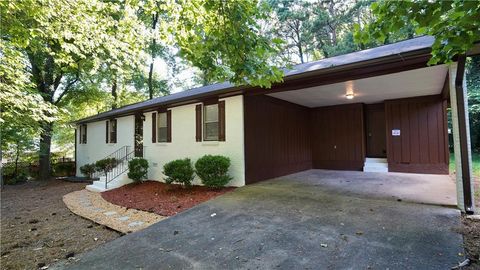 Photo of 5521 E Wind Drive SW, Lilburn, GA 30047 (MLS # 7638396)