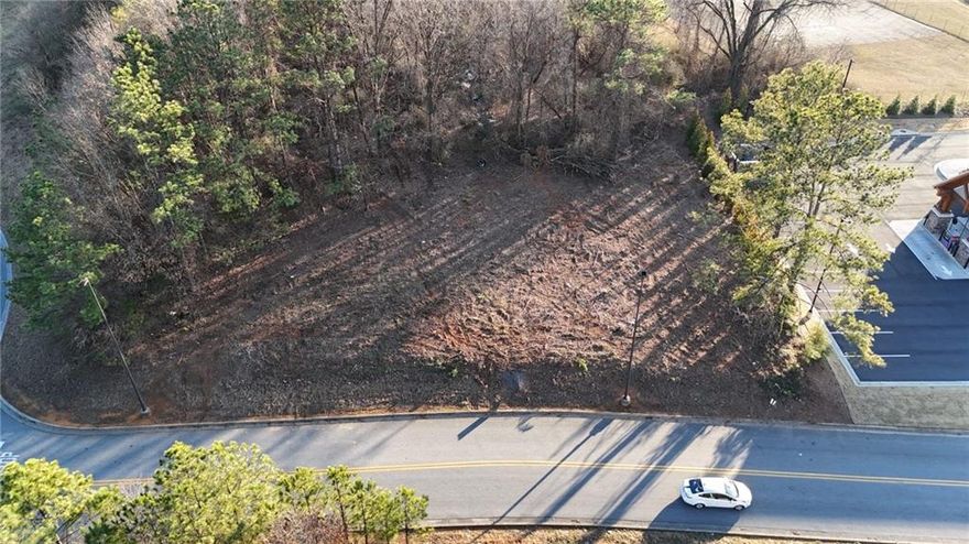 Commercial lot opportunity in Calhoun, GA! This C2 zoned lot, within city limits, offers 1.25 miles proximity to I-75, providing excellent access to both Atlanta and Chattanooga markets. Surrounded by major retail such as Kroger, Walmart, The Home Depot and Ross and restaurant chains, this site benefits from high traffic and visibility. All city utilities are readily available, streamlining the development process. This is a chance to invest in a growing regional economy with strong development potential.