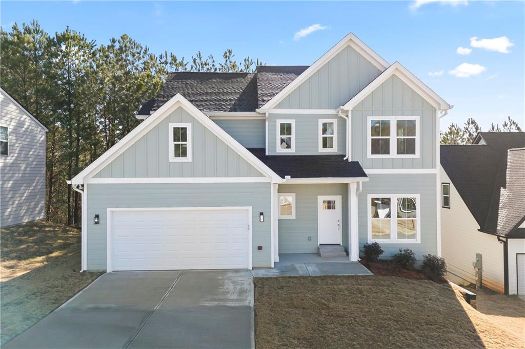 Welcome to this stunning NEW CONTRUCTION 3-bedroom, 2.5 bath home, thoughtfully designed for both style and functionality. Experience true hardwood floors flowing throughout the home, complemented by stylish tile in the bathrooms and laundry room. The main floor greets you with a welcoming foyer, leading to a separate dining room and a beautifully appointed kitchen featuring ample white cabinetry, a large solid surface island, and countertops. The kitchen seamlessly flows into the living room, creating the perfect space for entertaining. An additional main-floor flex space offers endless possibilities - it can serve as extra storage, a mudroom, or a cozy office. The garage has been upgraded with an epoxy-coated floor for added durability and style. Abundant windows throughout the home allow natural light to pour in, creating a bright and airy atmosphere. Upstairs, you'll find three generously sized bedrooms, including a luxurious primary suite with a spacious en-suite bathroom featuring a double vanity, tile floors, a separate tub and shower, and a large walk-in closet. The two additional bedrooms each include walk-in closets and share a charming Jack-and-Jill bathroom, accessible through stylish sliding barn doors. This bathroom is complete with a double vanity, tile floors, and a tub/shower combo. A conveniently located, well-sized laundry room with tile flooring completes the upper level. For even more potential, this home sits on an unfinished basement, ready for your personal design touches. Don't miss the opportunity to make this exceptional home yours! Priced below appraised value and is available now!