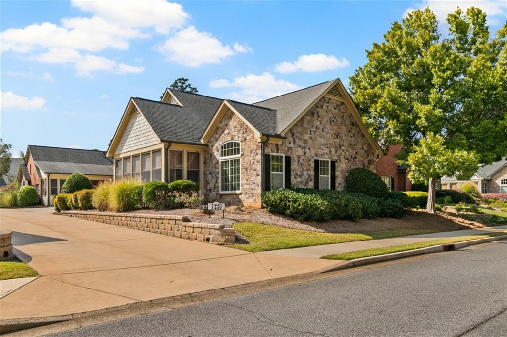 Welcome Home to Brookhaven of East Cobb! Tucked away on a peaceful, tree-lined street yet only moments from shopping, dining, and easy access to I-575 and I-75, this beautifully designed Jim Chapman neighborhood offers the perfect blend of comfort, convenience, and style. Step inside to a bright, open-concept kitchen and family room filled with natural light—ideal for entertaining or relaxing with the family. The spacious main-level primary suite features an en suite bath and generous walk-in closet. Two additional bedrooms and full bath provide plenty of space for guests, a home office, or hobbies. Enjoy your morning coffee or a relaxing evening in the charming sunroom or enclosed porch. The conveniently located laundry room off the kitchen is plumbed for a sink, adding even more functionality. Upstairs, discover a versatile bonus space complete with an additional bedroom and bath—perfect for overnight visitors or a private retreat. Special touches throughout the home include two light tubes bringing in extra sunshine, under-cabinet lighting in the kitchen, and a recirculating hot water system for comfort and efficiency. Don’t miss your chance to call this sought-after community home!