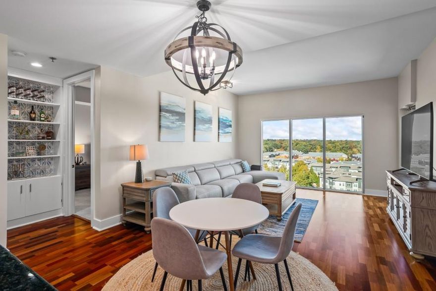 Luxury High Rise Living at The Manhattan! Stunning 16th floor end unit with unobstructed views. This open concept layout features floor to ceiling windows in the living room, a modern kitchen with island, custom cabinetry & stainless steel appliances. The spacious layout provides privacy between the Owner’s Suite & secondary bedroom. This home includes 2 deeded parking spaces and a huge storage unit. Enjoy resort style amenities, 24-hr concierge, fitness center with yoga rooms, resort style pool, Sky Lounge, tennis/pickleball courts, club room with golf simulator, dog park, patio with grills, guest suites and more! Located next to Super Target and walking distance to Ashford Lane, offering boutiques, shops, dining, bars and a 70,000 sq. ft. central lawn with outdoor dining & music. Minutes to Perimeter Mall, Publix, GA400, I-285 & MARTA! A MUST SEE!
