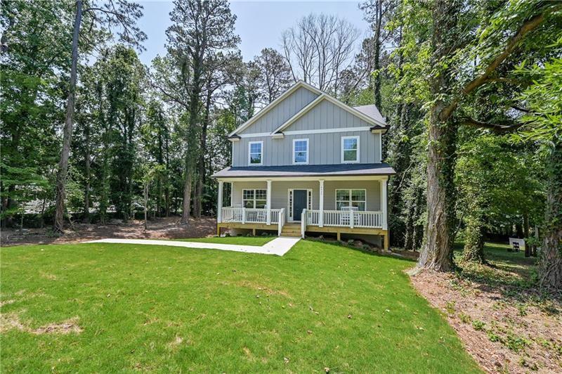 New construction just a mile from downtown Acworth! This craftsman style home features an open concept floor plan with large island and hardwood style flooring throughout main level. Designer black fixtures create a beautiful modern feeling to entertain guests. Bedroom on the main level with full bathroom is perfect for a guest or in-law suite. Enjoy the large back deck for outdoor grilling, or sit on the rocking chair front porch. Upstairs features an additional 3 spacious bedrooms, with the master suite offering a large, brand new bathroom with double vanity and soaking tub. Back yard has been landscaped with underground draining and is ready to be seeded and fenced! Quick access to 75 makes this an ideal location!
