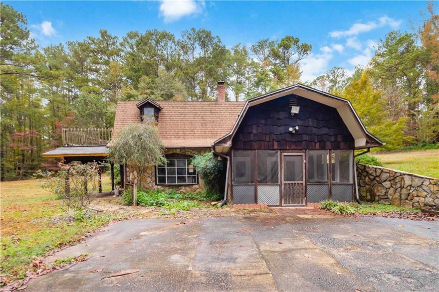 Nestled at the end of a quiet gravel road, 170 Pebble Path in Douglasville offers a rare opportunity to own a truly unique property on a sprawling 2.67-acre private oasis. This charming 3-bedroom, 2.5-bath home spans nearly 3,000 square feet and is brimming with character and potential. The heart of the home features a gorgeous custom-built stone fireplace, a testament to the handcrafted stonework that adds warmth and rustic elegance throughout the living space. Multiple outdoor living areas—including a screened front porch, a covered patio off the living room, and a private deck off the upstairs primary suite—invite you to relax and soak in the serenity of the surrounding woods. This secluded retreat offers endless possibilities. With no through traffic and nature as your neighbor, this is the peaceful escape you've been waiting for. Can be sold with 166 Pebble Path as well!