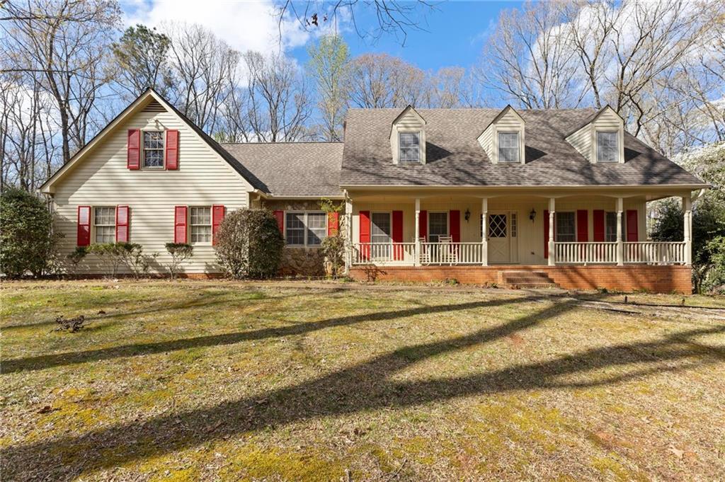 *** PRICE IMPROVEMENT*** Privately situated on 7.8 wooded acres in Fayetteville! No HOA!! A charming home with plenty of room for everyone! The main level features a formal living room, dining room, recently updated kitchen, breakfast area, cozy great room with brick fireplace and wood beamed ceilings. You want a master on the main? You got it! Peacefully situated away from the busy areas of the home. You'll enjoy a nice spacious closet, large bathroom with separate vanities, a jetted tub and shower combo. Head on upstairs to another large bedroom with it's own private bathroom, two additional nice size bedrooms (one has a bonus room connected), an office area or den, and a full bathroom. A must see is the full finished basement which includes a wet bar, large seating area, pool table, and even room for gym equipment. There is a shed on the property and a parking pad for your RV. Plus, a ton of storage and lots of land. Bring your personal vision and make it your own! The possibilities are endless.
The location is ideal!!! Approximately 4 miles from Trilith Studios, 5 .3 miles from Piedmont Fayette Hospital, 15 miles from Harstfield-Jackson Atlanta Airport, and 12 miles from Atlanta Motor Speedway.
The home's exterior was fully painted in the fall of 2022. Home is being sold AS IS.