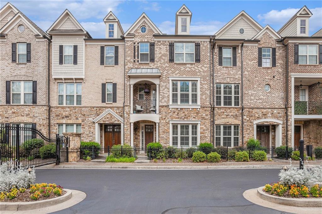 This elegant, move-in ready townhome offers an exceptional blend of style, comfort, and function across three spacious levels.
Step inside the lower level to a welcoming mud area, a full bath, and a versatile office space—perfect for working from home or hosting guests.
The heart of the home boasts an expansive living area with hardwood floors and custom wood plantation shutters throughout. The chef’s kitchen is a true showstopper, featuring stainless steel appliances, Carrera marble counters, soft-close cabinets and drawers, an oversized island with seating for four, a walk-in pantry, and under-cabinet lighting. The kitchen flows seamlessly into the fireside den and dining area, with a large deck just beyond—complete with a natural gas grill for year-round entertaining. A stylish half bath completes this level.
Retreat to the luxurious primary suite with a spa-like bath, double Carrera marble vanities, an oversized double shower, and a huge custom Elfa closet. Two additional bedrooms share a well-appointed secondary bath.
A two-car garage with electric charging station, bike rack, and a storage closet ensures every need is met.
Easy access to I-85. Close to Emory University, Children’s Healthcare of Atlanta, and CDC.
With its upscale finishes, abundant storage, and exceptional layout, this townhome is perfect for those seeking style, comfort, and convenience in one remarkable package.