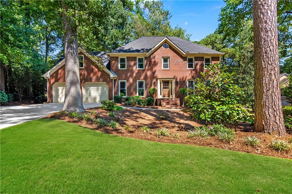 Welcome to 138 Lakeside Dr NW, where everyday living feels a little more peaceful. Nestled in the established Chastain Lakes Community with tennis courts, a pool, and its own private lake, this beautifully renovated home is the perfect blend of calm retreat and connected lifestyle. Inside, you’ll find 5 bedrooms and 2.5 bathrooms timelessly renovated for today's buyers. The main level showcases freshly refinished wood flooring, while upstairs features new, durable LVP for easy, low-maintenance living. A finished basement adds even more flexibility—ideal for a media room, home gym, or playroom. The primary suite is a true retreat. Sunlight streams into the spa-like bathroom, where a natural wood vanity, soaking tub, and separate shower create a serene space to unwind. The spacious bedroom offers plenty of room to recharge, making it a cozy haven at the end of the day. Out back, the screened-in sunroom overlooks lush, mature landscaping and offers a tranquil spot for morning coffee or quiet evenings. The covered deck, stubbed for gas, is an entertainer’s dream—perfect for weekend grilling and gatherings with friends. With peace-of-mind updates including a new roof, newer windows, and upgraded plumbing throughout, this home has been cared for from top to bottom. And when it’s time to venture out, you’ll love the convenience of being just minutes from KSU and easy access to I-75 and I-575. At 138 Lakeside Dr NW, you’ll find more than a house—you’ll find a home that makes every day feel easier, warmer, and more connected.