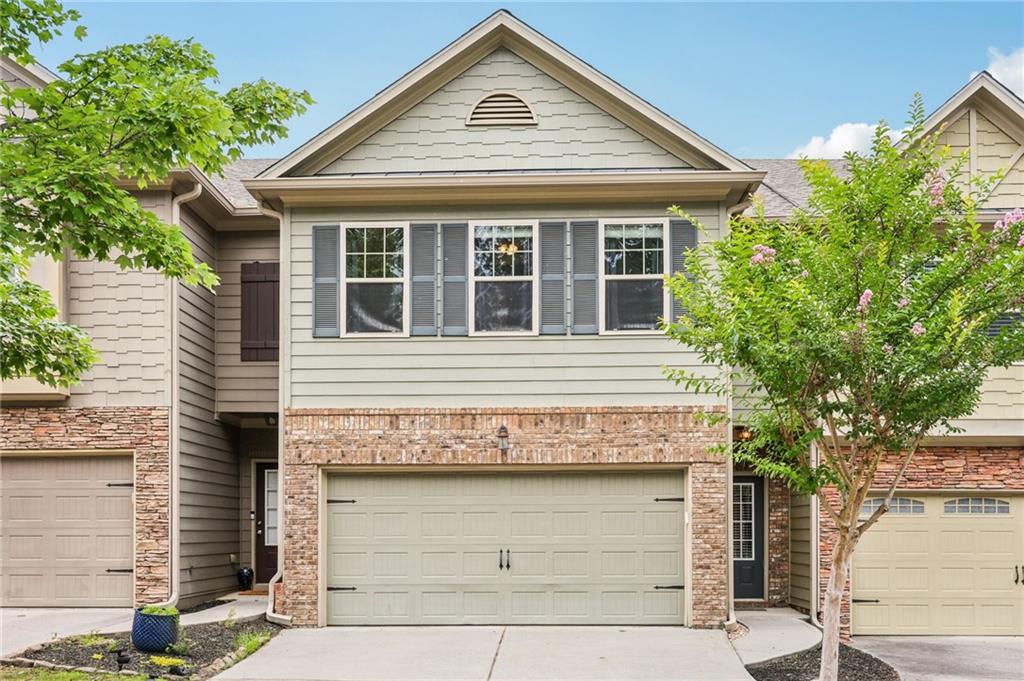 Listed by Mano Sells Homes: Tucked into the sought-after Sunset Pointe neighborhood of Woodstock, this townhome is the perfect blend of comfort, style, and location. Inside, the open floorplan creates an airy, inviting space that's ideal for entertaining or simply enjoying everyday life. The living room centers around a charming fireplace-adding warmth and character to your main gathering area. Upstairs, you'll find three generously sized bedrooms, including an oversized master suite that truly impresses. All new carpet installed in May 2025 and LVP flooring . With room for a sitting area, dual walk-in closets, and a spacious ensuite bath featuring a soaking tub, it's a personal retreat you'll love coming back to. Step outside to a private, fenced-in backyard with a patio-perfect for grilling out, relaxing, or hosting friends on sunny afternoons. Love the lake life? This home is just minutes from Lake Allatoona with easy access to nearby marinas for all your lakeside adventures. Convenient to shopping, dining, schools, and entertainment-this one checks all the boxes. Schedule your showing today and come see what makes this home so special!