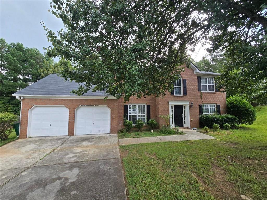 Welcome to 6885 Almont Cove — a spacious home nestled in a desirable swim and tennis community, just minutes from major highways, popular dining, shopping, and beautiful Stone Mountain Park. Step into the impressive two-story foyer and discover a versatile bonus room—ideal as a media space, home office, or potential 5th bedroom. The formal living and dining rooms offer a great setting for entertaining guests and hosting special gatherings. The eat-in kitchen features warm oak cabinetry, granite countertops, a breakfast bar, and sleek black appliances. Just off the kitchen is a generous family room with a cozy fireplace and abundant natural light—perfect for everyday living and relaxing. Upstairs, retreat to the oversized primary suite with tray ceilings, dual vanities, a separate soaking tub and shower, and a spacious walk-in closet. Three additional bedrooms and a well-appointed guest bath complete the upper level. This home offers unbeatable value for the space, location, and community amenities. Don’t miss this opportunity—schedule your private tour today and take the next step toward homeownership! Please note: due to some repairs needed, the property does not qualify for FHA or VA financing—cash, conventional, or renovation loans only.