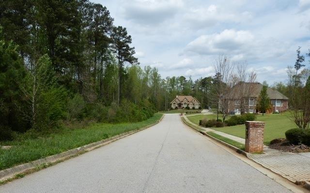Great potential basement, crawl space, or slab lot located in desirable high end community. Homes range in the 450K-600K. Last 2 homes in the subdivision were sold for $570k and $601K. Ready to build on for single family home on 1.18 acres. GREAT FOR BUILDER or Owner build....little restrictions per county building requirements. Subdivision is on septic tank. Seller also has 1 more lot for sale in same subdivision (313 Ashborough Pl). Also other lots available, perfect for small builder. No HOA and little restrictions. If this lot doesn't fit your needs, ask about other lots available in other subdivisions.
