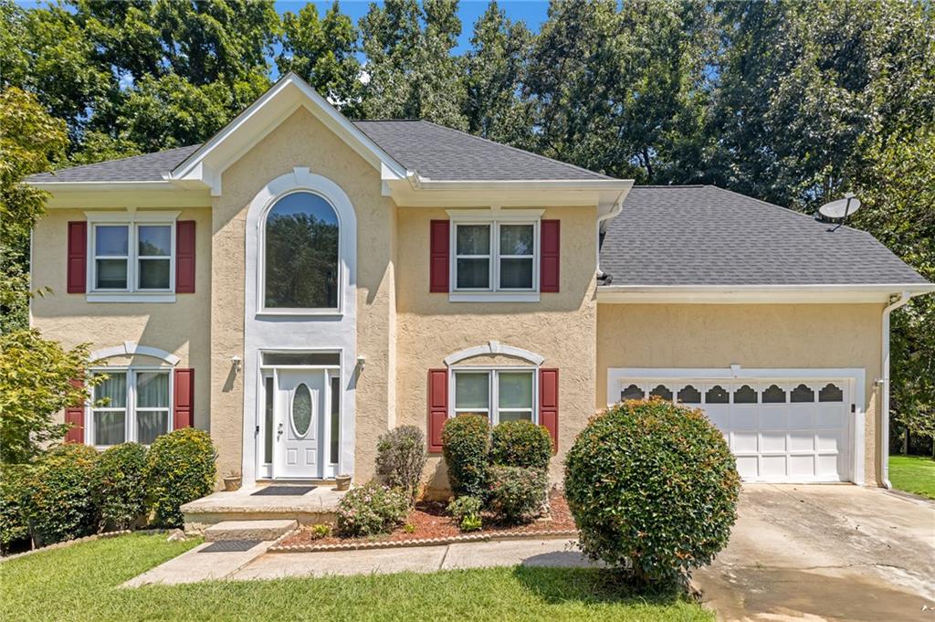 ***NEW IMPROVED PRICE***This hidden gem nestled on an expansive 3.52-acre PRIVATE LOT in the heart of East Point. This spacious 4-bedroom, 2.5-bath traditional home offers over 2,400 square feet of comfortable living space and endless potential inside and out. Tucked away in a quiet, established neighborhood, this property provides rare privacy just minutes from downtown Atlanta, Hartsfield-Jackson Airport, Tyler Perry Studios, and major highways. Step inside to a classic two-story layout featuring a bright and airy living room, separate dining area, and a cozy family room with fireplace-perfect for entertaining or quiet evenings at home. The large kitchen includes ample cabinet space and a breakfast area overlooking the serene, wooded backyard. Upstairs, you'll find four generously sized bedrooms, including an oversized primary suite with a private bath and walk-in closet. Major system updates have already been taken care of with a NEWER ROOF and WATER HEATER, giving you peace of mind and reduced maintenance costs. Enjoy the peaceful outdoors from your expansive backyard-ideal for gardening, a future pool, or even building an additional structure. With over three acres of space, the possibilities are endless. This home also features a two-car garage, ample driveway parking, and central heating and air. Whether you're looking to create your dream estate, invest in land, or enjoy room to grow, this is a rare opportunity in a location that blends convenience and tranquility. Don't miss your chance to own one of the LARGEST LOTS in the area-schedule your private showing today!