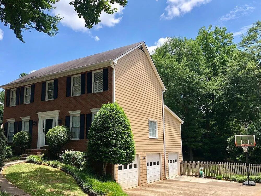 Charming 4-Bedroom Home with Sunroom, Finished Basement, Fenced Backyard & 3-Car Garage in East Cobb. Beautifully maintained 4-bedroom, 2.5-bath home located in one of East Cobb’s premier swim/tennis communities. This spacious home blends comfort and functionality, perfect for modern family living. Minutes from top-rated schools (Pope, Hightower Trail, Mountain View), shopping, restaurants, library, and aquatic center. Newly repainted, appliances updated, and deeply cleaned. Main Level: separate dining and living rooms; cozy family room with built-ins and double-sided fireplace shared with spacious sunroom; large kitchen with a center island; sunny breakfast room; laundry room with window and storage; freshly stained deck. Second Floor: large master suite with two walk-in closets; master bath with walk-in shower and granite countertop; 3 additional bedrooms and 1 secondary bathroom. Basement: two finished rooms; large under-deck patio; ample storage space.