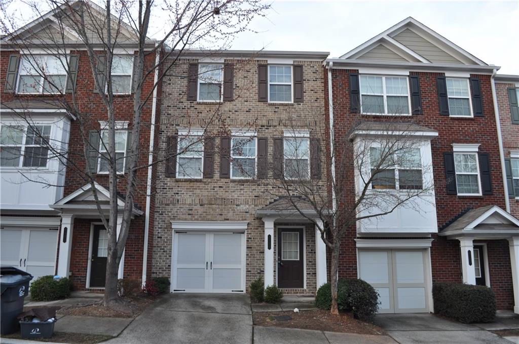 THIS BEAUTIFUL AND SPACIOUS TOWN HOME IS LOCATED MINS FROM I-85 AND ARENA CLOSE TO SHOPPING AND RESTAURANTS IN A VERY SOUGHT AFTER SCHOOL DISTRICT LOCATED IN A GATED NEIGHBORHOOD. THE HOME IS LOADED WITH UPGRADES AND IS RECENTLY PAINTED. THE HOME FREATURES ONE CAR GARAGE, UPGRADED LIGHT FIXTURES, NICE FLOORING ON ALL THREE THREE FLOORS (CARPET IS ONLY ON THE STAIRCASE), NEW FIREPLACE, AND A NEW HVAC UNIT, NICE BATHROOMS. PRICED VERY AGGRESSIVELY TO SELL. WON'T LAST LONG. LOWER LEVEL HAS BED/BATH, PERFECT FOR IN LAW SUITE. LANDLORD IS A LICESNSED REAL ESTATE AGENT IN THE STATE OF GA.
