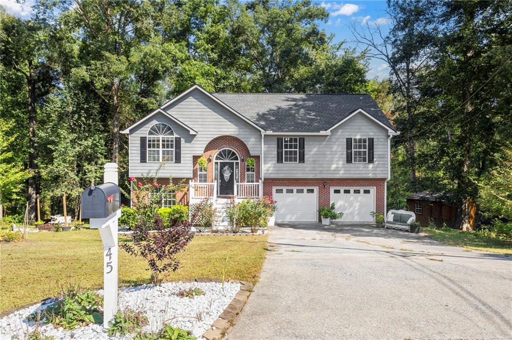 This is the one you've been waiting for! Meticulously maintained, this home boasts nearly 2200 sf of gorgeous space for you and your loved ones! Bathed in natural light and perched above a trickling backyard creek, this home feels more like a permanent retreat!
With an entire suite downstairs with it's own bathroom and private deck, this layout is perfect for multigenerational living! The over-sized lot is home to a sweet little greenhouse and is bursting with colorful flowers and plants that enhance the beauty of the property. Sip cider and roast marshmallows at your own dedicated, charming fire pit area this fall! Store all your toys and tools in the large outbuilding, or make a separate private workshop or she-shed, and still have room in the double car garage! Its fenced-in back yard means all the littles are contained and ready to move in! Septic tank was just pumped and inspected in July, so you have peace of mind going in! This property offers everything! If all that wasn't enough, the community hosts a fully stocked lake within walking distance from the house. Take a lawn chair and relax watching the birds fly overhead or bring your fishing pole and make a day of it! A community that offers so much, and yet NO HOA! Does it get any better than this?
With this home's perfect size and location coupled with it's function and charm, at this fantastic price, it won't last long! Scoop it up now so you don't miss it!