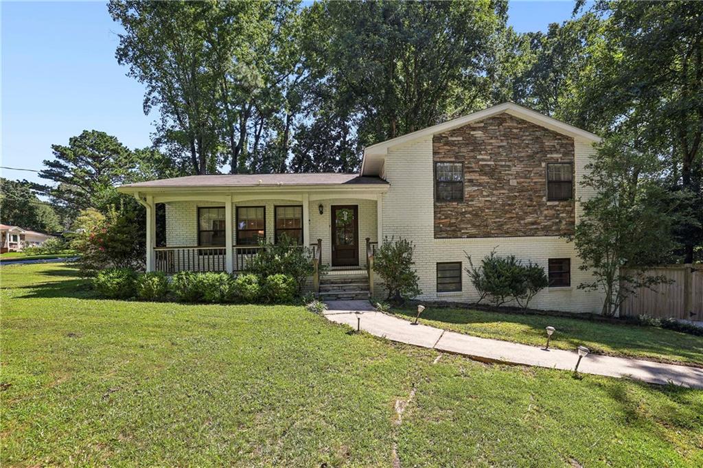 How charming this newly renovated home is and how convenient it will be to move right in! Every detail has been thoughtfully updated so you can skip the remodel and start enjoying your new space from day one. Located in the sought-after Laurel Ridge Elementary school district, this gem sits on a large, fenced, and playable backyard just steps from the patio perfect for outdoor living, pets, and play. Inside, the home has been opened up to create an expansive, light-filled layout. The gorgeous new kitchen boasts brand-new appliances, counters, and tile, while every bathroom has been beautifully redesigned with new tile, sinks, toilets, and showers. Fresh interior and exterior paint, new hardwood flooring and carpet, and solid-core doors elevate the home's quality and appeal. In the living room, a new electric fireplace with a custom wood mantle adds warmth and charm, while designer lighting fixtures enhance every room. You'll appreciate the newer roof and new water heater just a few of the many upgrades that make this home move-in ready. The lower-level family room with a full bath is a flexible space ideal for a home office, gym, media room, or guest suite. And with abundant storage, you'll have a place for everything. All of this is in a prime Decatur location with easy access to Emory, CDC, VA, CHOA, shopping, dining, and more. 1112 Mayfield Drive is truly the whole package: style, comfort, convenience, and a location you'll love.