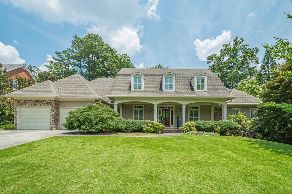 Welcome to this beautifully updated home featuring new carpet and flooring though out and freshly painter interior! Shows like new! Inviting foyer opens to gleaming hardwood floors, a formal living room, and banquet size dining room - perfect for entertaining! The gourmet kitchen offers custom cabinetry, built-in desk, and large pantry. Sunny breakfast room. Expansive great room boasts a stunning rock fireplace with gas logs and starter, flanked by custom built-in cabintry. Soaring ceilings. The oversized owner's suite on the main level has two generous walk-in closets and a luxurious spa-like bath with double vanities, a whirlpool tub, and separate shower. Upstairs, you'll find two oversized bedrooms connected by a large Jack-and-Jill bath, plus versatile loft area - ideal for a home office, reading nook, or play space. The full, unfinished basement offers endless potential for expansion! Already framed and stubbed for bath, this space is ready to be customized to suit your lifestyle needs. Additional highlights include a two-car garage, central vacuum system, sprinkler system. Handicap accessible. Located in a top-rated school district and minutes from shopping, dining, Kennesaw Mountain and The Avenues, this home offers both convenience and charm. Home shows like new and ready for your arrival today!