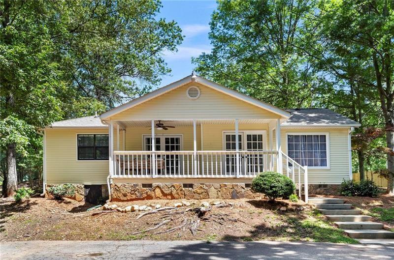 This charming farmhouse-style ranch is nestled on a 1-acre lot in the heart of North Paulding. This home offers tons of upgrades throughout and plenty of natural light. You'll love the hardwood floors that flow through the main living spaces and the separate dining area that's perfect for gatherings. The kitchen features an eating bar at the window, adding both charm and function to the heart of the home. Step out of the family room onto the covered rear porch—great for enjoying peaceful mornings or summer nights. The primary suite showcases beautiful wood accents and the bathrooms have been tastefully updated. This is a great opportunity located in top school districts—a little bit of country charm with modern flair!