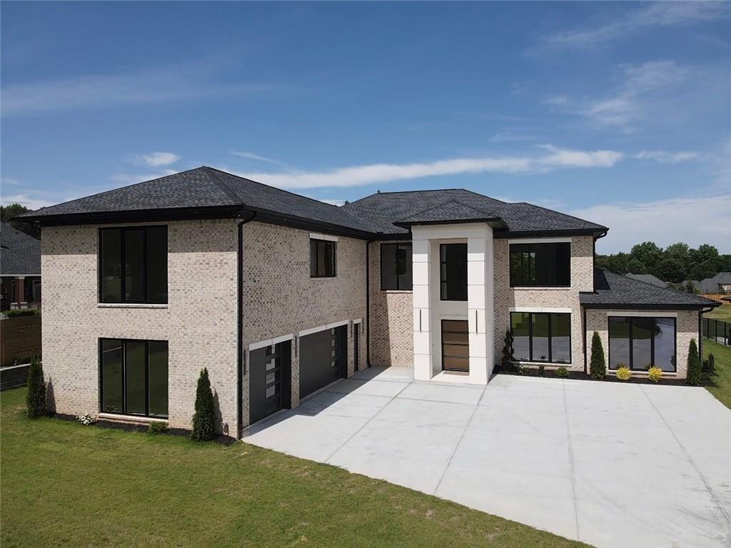 Stunning Modern New Construction Home located on Camp Branch Rd. in Gwinnett County. The grand two-story foyer leading into the sensational, breathtaking 22-foot living room is adorned with European windows that flood the space with natural light. With its open-concept layout, the living room flows seamlessly into the dining area, offering an inviting space for gatherings and celebrations. Step into the kitchen of your dreams, where all your hosting dreams come true. Including a scullery allows you to keep the mess out of sight, letting you focus on creating memorable experiences with your guests. The primary ensuite on the main floor is truly the room of your dreams, offering a perfect sanctuary that seamlessly blends luxury and comfort. A stunning sliding door opens to invite you to enjoy fresh breezes or peaceful mornings. The lavish bathroom features full tile walls and floors, exuding elegance with every step. Upstairs, you'll find three additional bedrooms, each with its own ensuite bathroom and walk-in closet, providing privacy and convenience for family and guests alike. Every closet is adorned with custom shelving that enhances organization and accessibility, making this home not only stunning but also exceptionally functional- truly a haven for modern living. During those warm summer days, you'll have the perfect opportunity to take advantage of your outdoor kitchen area, complete with a grilling section that's truly a chef's dream! Imagine hosting barbecues and gatherings with family in this beautiful space, creating lasting memories under the sun. Plus, with the option to design a future pool area, you can enhance your outdoor oasis even further. With an outdoor shower and bath already built-in!
Situated in highly sought after Gwinnett county location close to top-rated schools, shopping, restaurants, and entertainment.