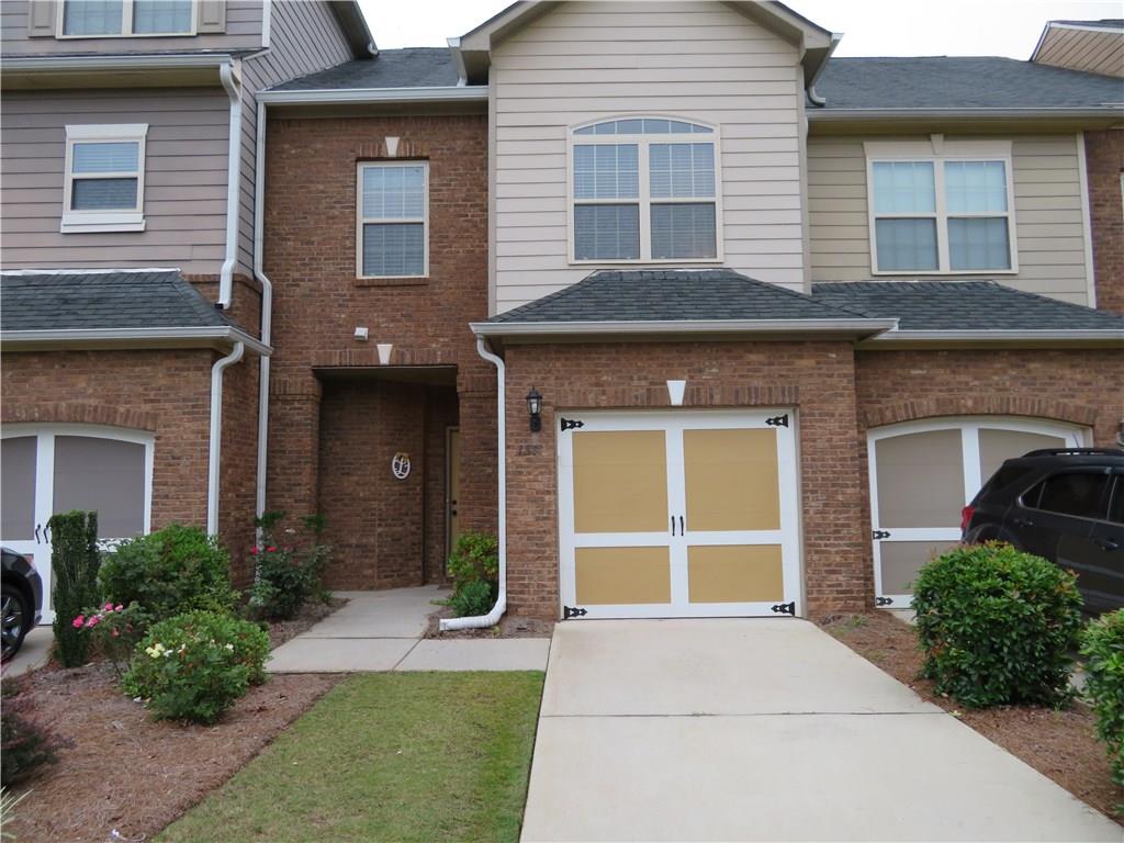 If you snooze, you're gonna lose this one. This townhome has been well loved AND upgraded! NEW A/C, NEW HARDWOOD FLOORS, custom built-in book shelves, brushed bronze and nickle hardware, remote entry garage door, AT&T fiber. The Master bedroom is a retreat to escape to at the end of a long day. Or maybe relax in the jetted, garden tub. The kitchen, with it's beautiful cabinets and granite counter tops, is open to the family room. And did I mention the Silver Comet Trail is practically in your back yard? Don't miss the opportunity to own this gem.