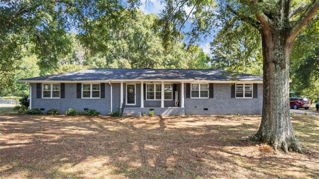 Welcome home to this 3 bedroom 2 bathroom brick ranch located in the Model School district. This home sits on +/- 1 acre with a detached garage/workshop. Single level layout with gas-log fireplace, spacious bedrooms, and low maintenance exterior. Plenty of yard for outdoor use and storage.
