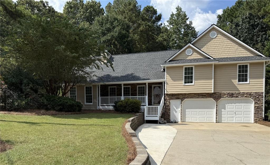 Beautiful 4 bedroom 3 bath home in East Paulding School District. This home features two master bedrooms and 2 additional secondary bedrooms and three full bathrooms. So much love has been put in this home since it was purchased new in 1996. The owners added a full master addition with a full bathroom, home office and exterior entry from the backyard, making this home a true 4 Bed/3 Bath home. You will love cooking in this newly updated kitchen with breakfast nook while still being able to interact with your guests in the adjoining dining room and family room. The 2 car drive under garage boasts a large laundry room and additional workshop space plus offers easy access to the crawl space from inside the garage. You will enjoy spending your evenings sitting on the huge deck this fall while listening to the leaves rustle as the cool, crisp air of country living blows across your face. If entertaining is your thing, you will enjoy the beautiful firepit that was built in back where you can host parties year round. A large building with a full upstairs would be a great workshop for all of your projects and provides covered parking for your boat or lawn equipment. Easy access to Hwy 92, Dallas Highway, Downtown Dallas, Hiram and Acworth. Close and convenient to shopping and restaurants. This is a great home for the money so don't let this one get away.