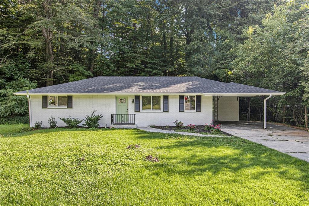 Welcome Home to this beautiful, fully renovated 3 bdrm 2 bath home. This traditional brick ranch sits on a flat, .56-acre partially fenced lot with peaceful wooded views and a backyard that feels like your own private retreat. It’s tucked into a friendly, established community.
This home has been opened up and thoughtfully updated for modern living. This home has beautiful hardwood flooring throughout, gorgeous marble flooring in the kitchen with stainless steel appliances, an island with a breakfast bar, and this layout fits your lifestyle. Renovated bathrooms feature dual-sink, marble vanity, beautiful tilework, and built-in cabinetry for all your storage needs. Two additional bedrooms sharing a second bathroom offer plenty of space to grow or host. A new Roof, hot water heater, and the AC unit were all installed in 2023. Out back, enjoy a large deck that’s ideal for cookouts, coffee, or winding down at sunset. And the location provides quick access to Oak Grove, Briarlake Park, Emory, CDC, Toco Hills, I-85/75, GA 400, Buckhead, Downtown, and even the Airport. Everything you need is just around the corner. Please Show and Sell today!