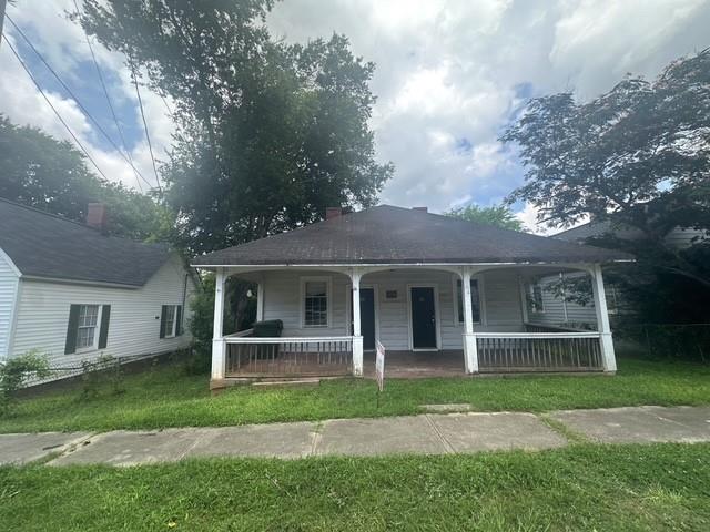 Welcome to this historic 2-bed, 2-bath duplex, offering a unique blend of vintage character and endless potential in the heart of Porterdale! This property boasts a beautiful open front porch, perfect for relaxing and taking in the charm of the neighborhood. The spacious back parking area provides convenience for tenants or owners alike. Inside, you'll find classic architectural details waiting to be restored to their former glory. Whether you're looking to renovate and maximize rental income or create a stunning owner-occupied property, this duplex is an ideal canvas for your vision. Located just minutes from local shops, dining, and entertainment, it’s a prime opportunity in a one-of-a-kind community. Don’t miss your chance to invest in this historic gem