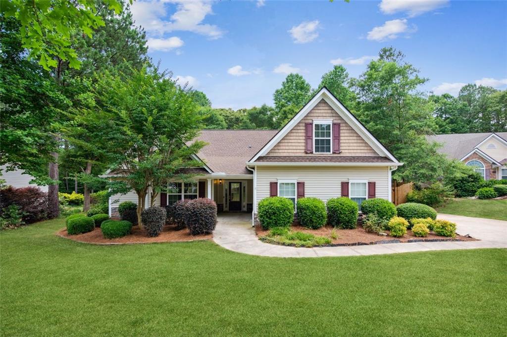 This 4 bdr/3.5 bath RANCH on over HALF ACRE lot is conveniently located just minutes from the shops, restaurants, and amenities of historic downtown Braselton, while still maintaining the quieter setting the area is known for! Mudroom area opens directly to laundry- no need to track anything through the house with this convenient "drop zone"! Beautifully remodeled kitchen boasts new countertops, refinished cabinetry, new backsplash, center island with room for seating, and large walk-in pantry! Kitchen flows into cozy living room, with shiplap fireplace feature wall and access to the fully fenced backyard! Yard also includes a large covered deck- perfect for entertaining and ready for your personal touch! Primary bedroom features fully updated en-suite- new walk-in shower with stunning tile work, refinished vanity/dual sinks, and new fixtures! Two secondary bedrooms finish out the main level, with additional 4th bdr/full bath above garage- perfect teen suite or guest space, or even for use as an office or fitness room! New paint and new flooring throughout, new roof, cul-de-sac location, and much more; you don't want to miss this one!