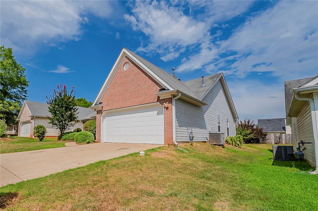This charming ranch home features 3 bedrooms and 2 full baths, a separate dining room, and a cozy living room with fireplace. Recent upgrades include full interior paint, brand-new carpet, updated light fixtures, freshly painted cabinets, quartz countertops, a new microwave, and a new garage door, offering added curb appeal and functionality-making it move-in ready with modern touches throughout.