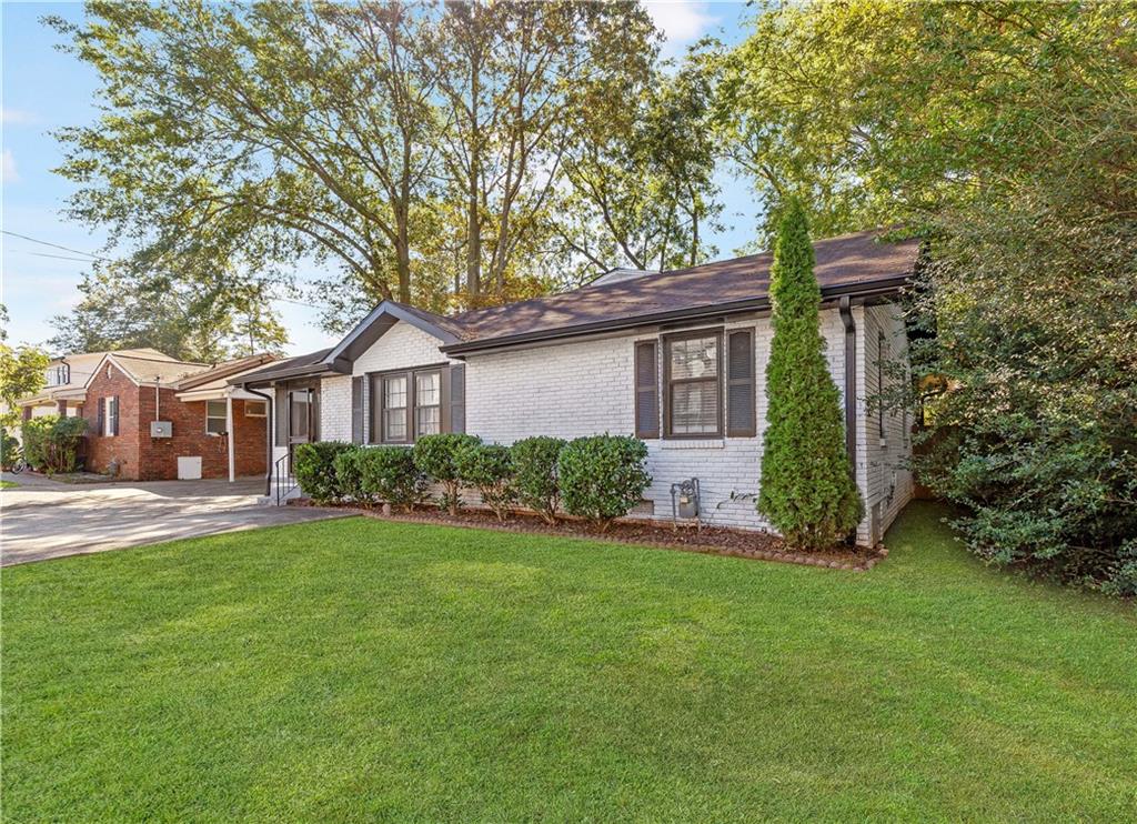 If you're looking for a family-friendly home that's just a short stroll from Smyrna Market Village, this beauty checks all the boxes. Experience the ultimate in comfort and convenience with this beautifully renovated single-level ranch in the heart of Smyrna. This vibrant home features a bright, spacious kitchen with luxurious white quartz countertops and sleek stainless-steel appliances-ideal for any culinary enthusiast. Gather in the large dining room, enhanced by stunning exposed beams, or relax in the sunlit front sunroom. The versatile 4th bedroom at the rear can easily be used as a home office. Enjoy the privacy of your backyard, perfect for sipping morning coffee or hosting evening BBQs with loved ones. Situated near Smyrna Market Village, downtown Smyrna, Truist Park, The Battery, Silver Comet Trail, golf courses, a diverse array of dining and shopping options, corporate offices, and just 30 minutes from the airport, this home provides exceptional access to the best of Smyrna. Better Hurry! This is the one!! This property is eligible for a $10k Truist Grant, ask about the details. ALSO, VA-ELIGIBLE BUYERS CAN TAKE ADVANTAGE OF ASSUMING THE CURRENT LOAN AT AN ATTRACTIVE 3.375% INTEREST RATE. This property is eligible for a $10k Truist Grant, ask about the details.