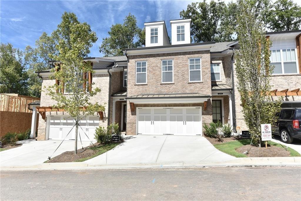GATED!!! END UNIT!! EXTRA SUNLIGHT due to corner/windows! Stunning 4 bed/3.5 bath new unit in Johns Creek. Mins from Johns Creek Emory Hospital, Windward, TRADER JOE'S, Halcyon, Avalon, Kroger, Publix restaurants much more!! Unit is within walking distance to Kroger, restaurants, etc. Gorgeous island, stainless steel appliances, upgraded flooring. The 4th bedroom/retreat/loft is a huge room that can be used as an entertainment area/home theater. Windward Lake, swim/tennis is available with an additional annual fee. A FENCED/PRIVATE BACKYARD YARD TO GET IN A TOWN HOME!