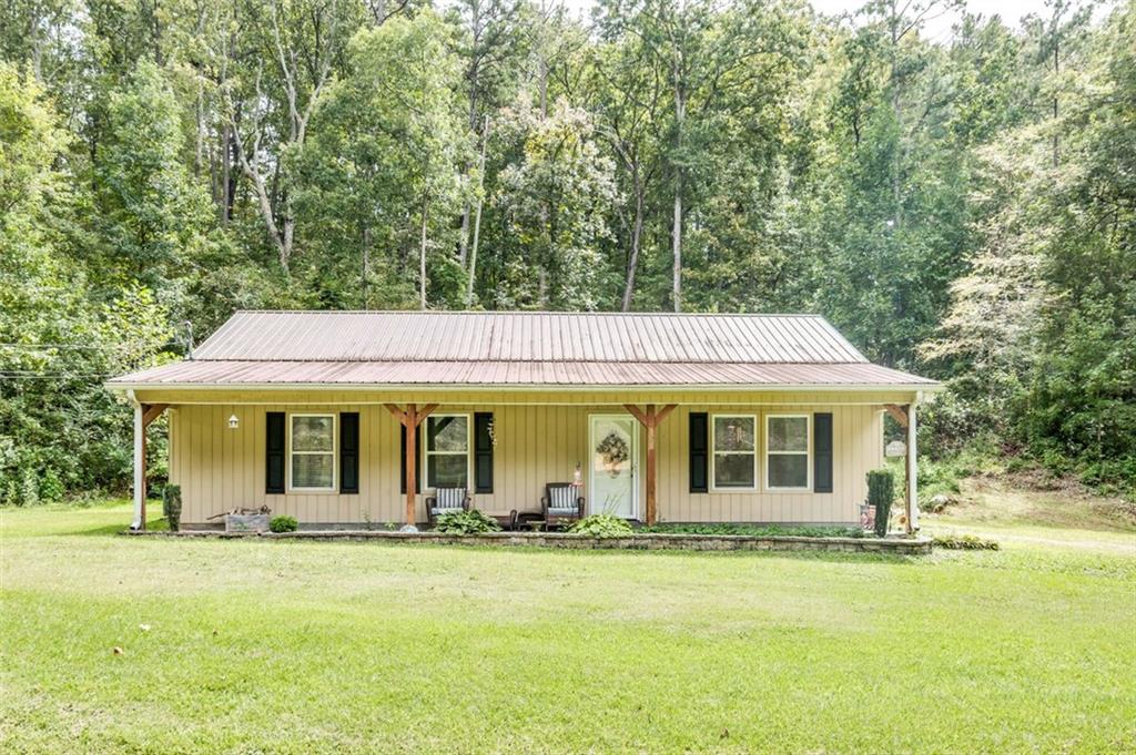 Discover the perfect blend of charm and comfort in this beautifully maintained ranch-style home. A durable metal roof and inviting covered front porch set the tone for timeless appeal. Inside, the spacious open floor plan is filled with natural light, creating a warm and welcoming atmosphere ideal for both everyday living and entertaining.
The dining area showcases elegant board-and-batten detailing, while the kitchen features sleek stainless steel appliances and a functional layout for the modern homeowner. With 3 bedrooms and 2 full baths, this home offers both style and practicality.
Step outside to enjoy a large yard framed by a mature privacy tree line—perfect for gatherings, gardening, or quiet relaxation.
Located just 10 minutes from Downtown Rome, this home combines everyday convenience with a peaceful setting.
This property offers thoughtful design, great incentives, and an unbeatable location—making it a wonderful place to call home.
Ask about our Lender-Paid 1-0 Buydown, lowering your interest rate by 1%